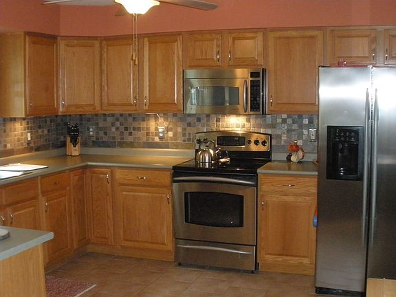 Stainless Steel Appliances with Slate Backsplash