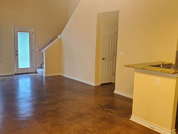 You walk in the front door and get a partial view of living room from the front door.