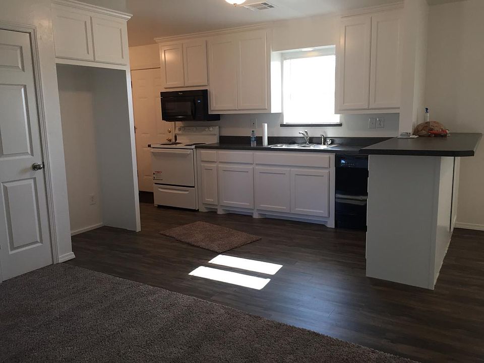 Flooring, carpet, stove, and microwave, all less than 2 yrs.