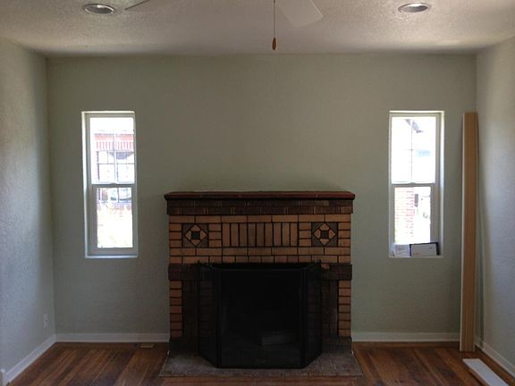 LR wood burning fireplace, ceiling fan