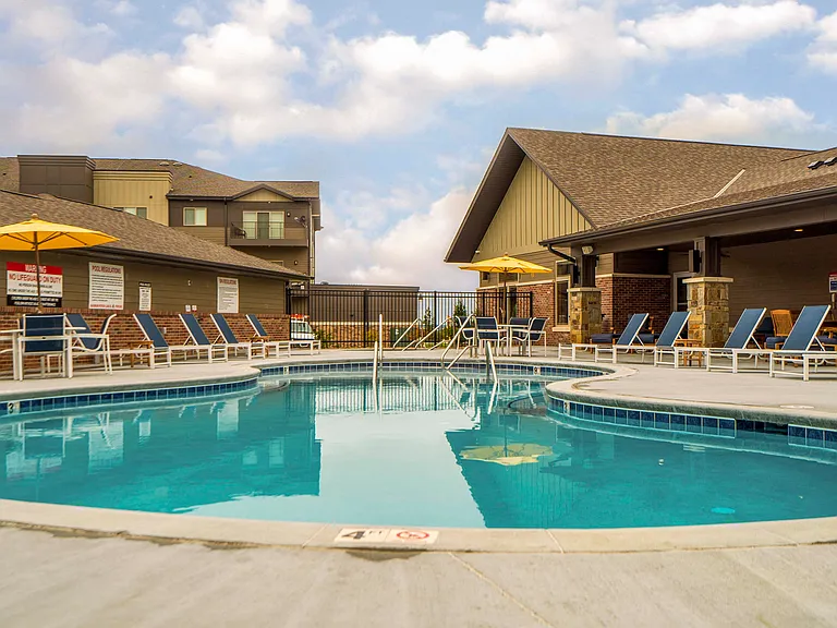 Dive into relaxation at our resort-style swimming pool, perfect for soaking up the sun.