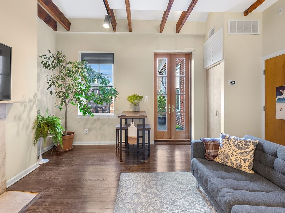 Entry door, living room, and French doors to private deck.