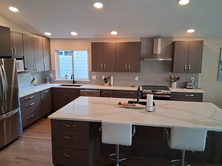 Brand new kitchen with seating area at large countertop