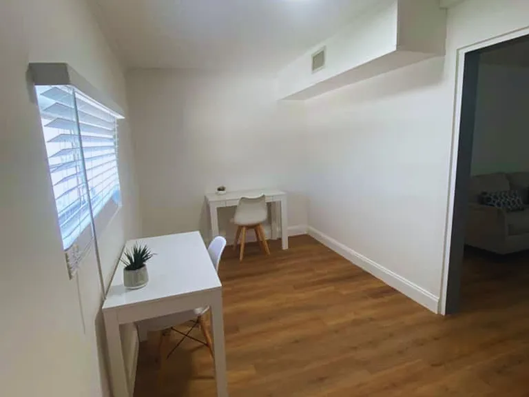 Dedicated workspace with two desks and chairs for work or study.