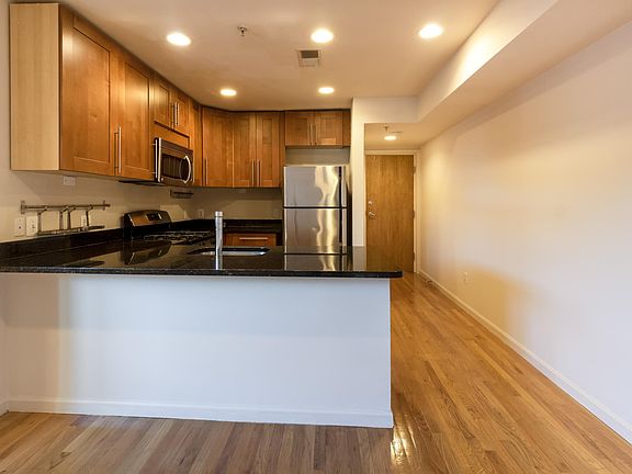 Looking into kitchen--with ceiling height cabinets.