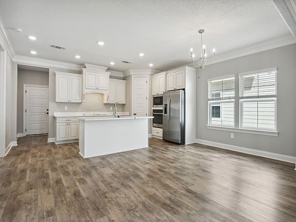 Dining area in the Royale floorplan at a Meritage Homes community in Gulfport, MS.