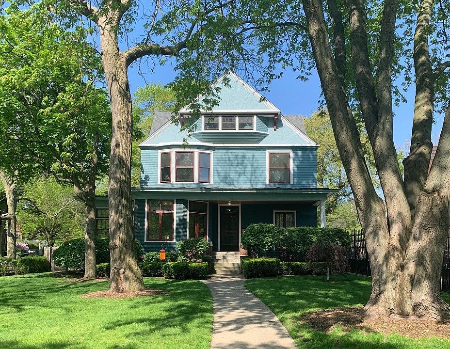 Situated on a lush corner lot in the Kenwood Landmark District, the stone walls of an earlier reside