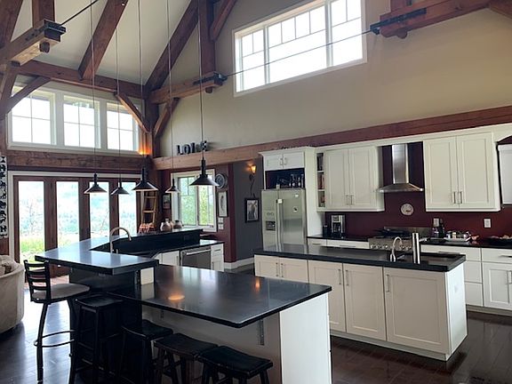 Large gourmet kitchen with island and bar area.