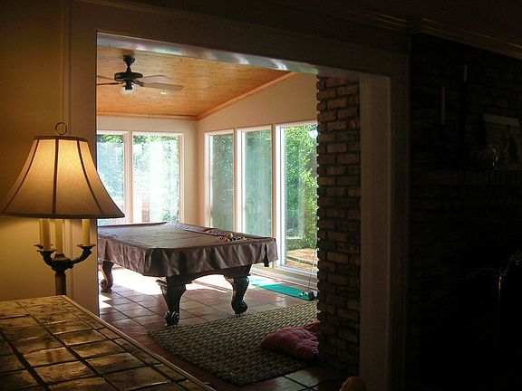 View to sunroom overlooking pool/backyard