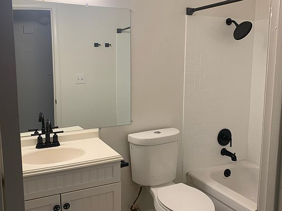Full bathroom with modern black fixtures