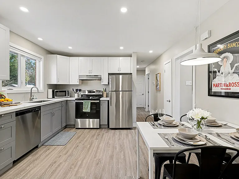 Fully equipped modern kitchen featuring stainless steel appliances in our Ottawa temporary housing.