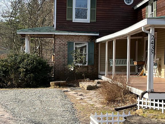 Kitchen porch and door on right. Looking at living room porch/door