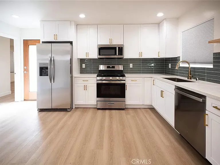 Brand new kitchen with stainless steel appliances
