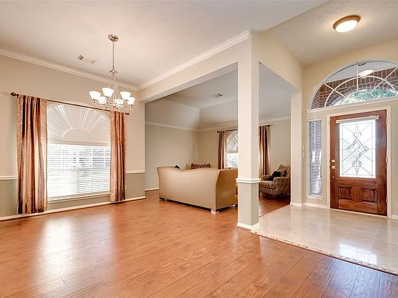 Custom blinds, High ceilings, Beautiful mill work, marble tile entrance