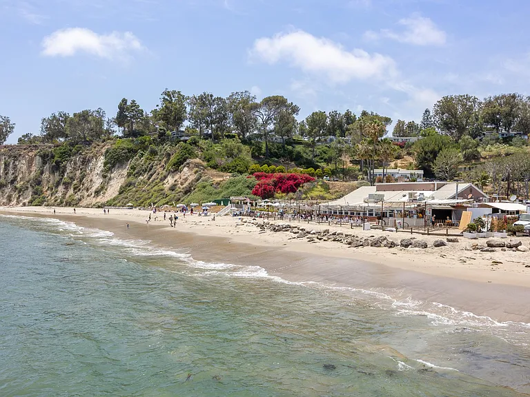 Swim, surf or bathe in the sun at Paradise Cove Beach tucked beneath the cliffs of Malibu.