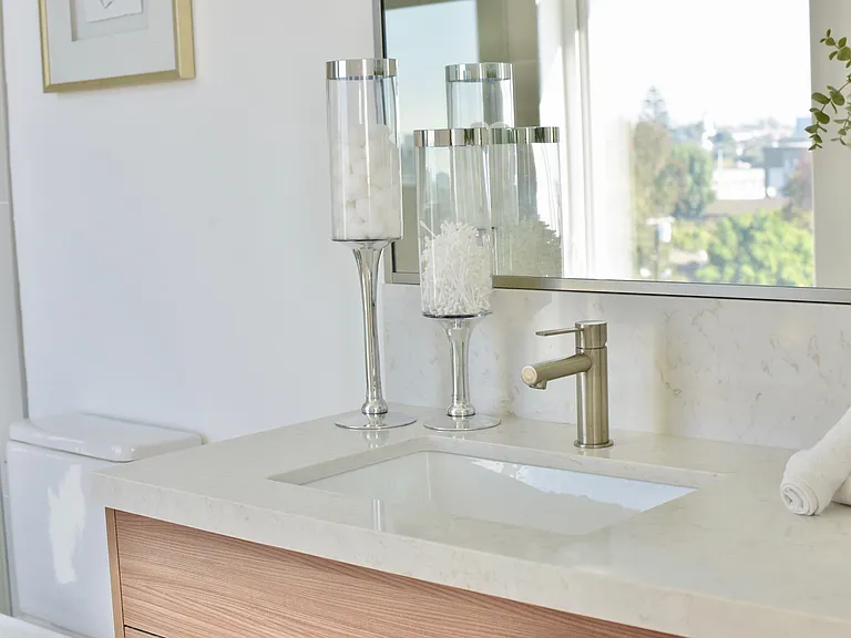 Custom Bathrooms with Quartz Countertops and Backsplashes
