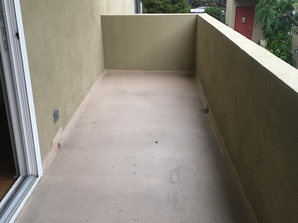 Balcony outside living room. There is also a very large shared patio in the rear of the building