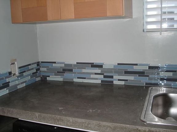 remodeled kitchen with concrete countertops