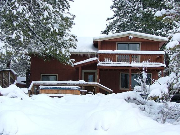 Winter Frontview of riverfront home.