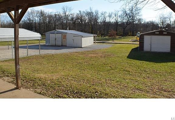 Plenty of covered parking and storage in this big backyard!