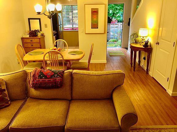 Open floor plan unifies kitchen, dining area and living room.