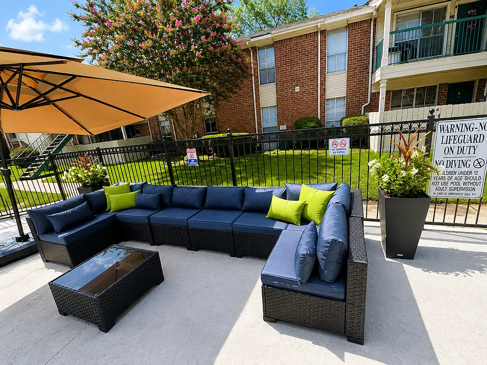 Comfortable poolside lounge area with shaded seating.