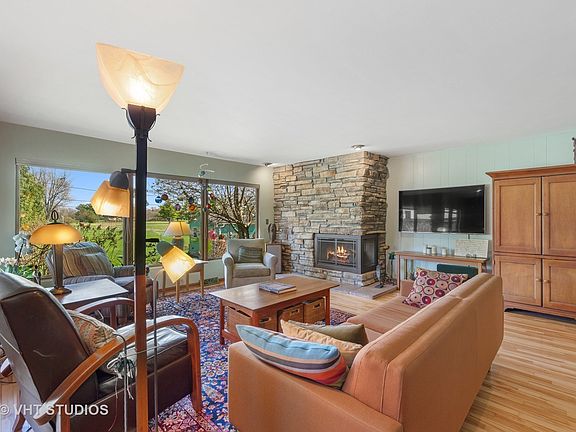 Enter into the living room with the beautiful windows that overlook the golf course back yard views 