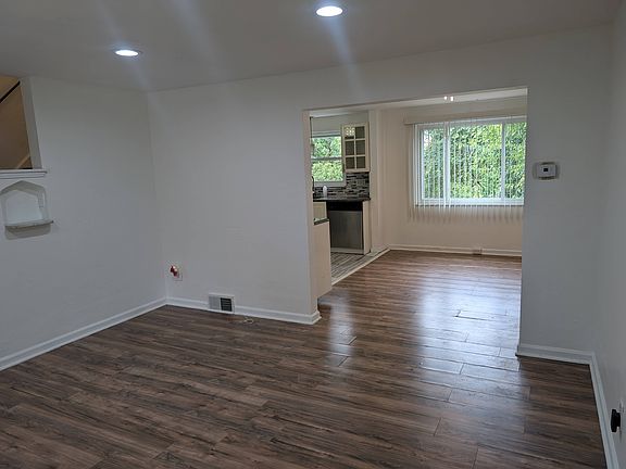 View of livingroom, dining room and part of kitchen.
