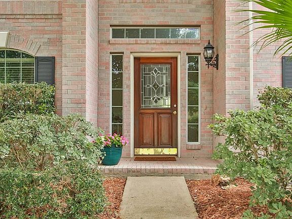 Welcome home to this light and bright recently updated two story home with 4 spacious bedrooms and a terrific floorpan.   The two story sunny foyer warmly welcomes guests into your new home.   Laminate wood, travertine, and tile flooring make up the first floor so no carpet!    Fresh neutral paint provides a nice backdrop to whatever your color scheme and design choices might be in the thoughtful floorpan.