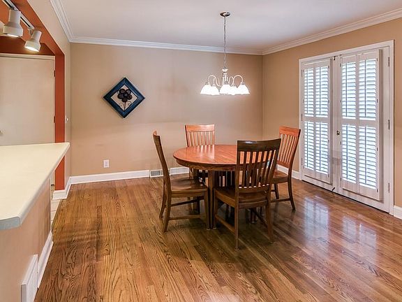 Informal dining room has plenty of room for your dining table to extend for large gatherings.  French doors with plantation shutters open to the porch which is nice for summer entertaining.