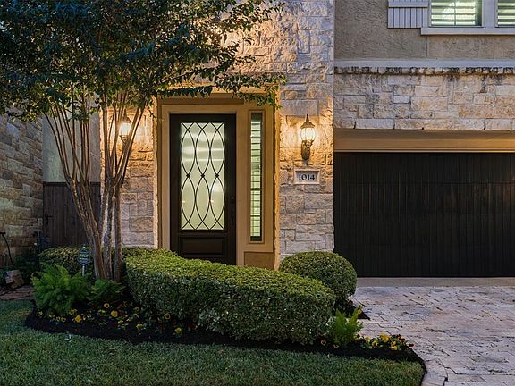 Lush Landscaping and Lighting welcome you as you drive in. The Stone Paver Drive Way and richly Stained Garage Doors are just a glimpse of the upscale and elegant finishes showcased throughout this sensational showplace!