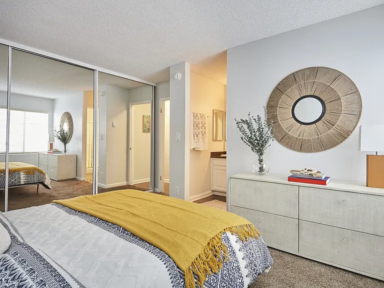 Modern Bedroom with Full Bed and Mirror Wall