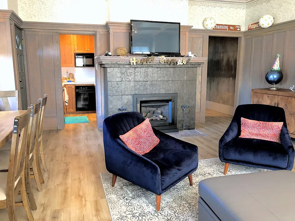 Cozy LR w/ Gas Fireplace Heater, Dining/ Study Table for 5pp to the left and the Kitchen beyond.
