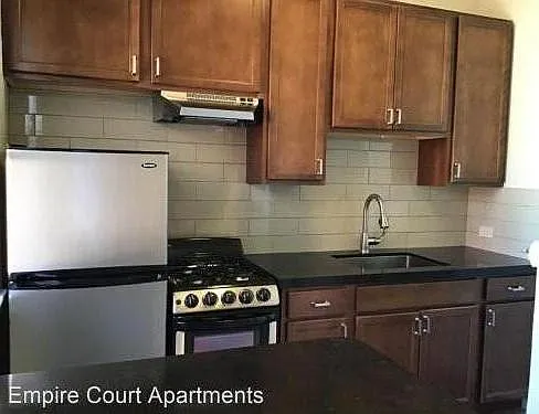 Remodeled Kitchen with new porcelain tile floors, backsplash, cabinets, cesarstone countertops and stainless steel appliances!