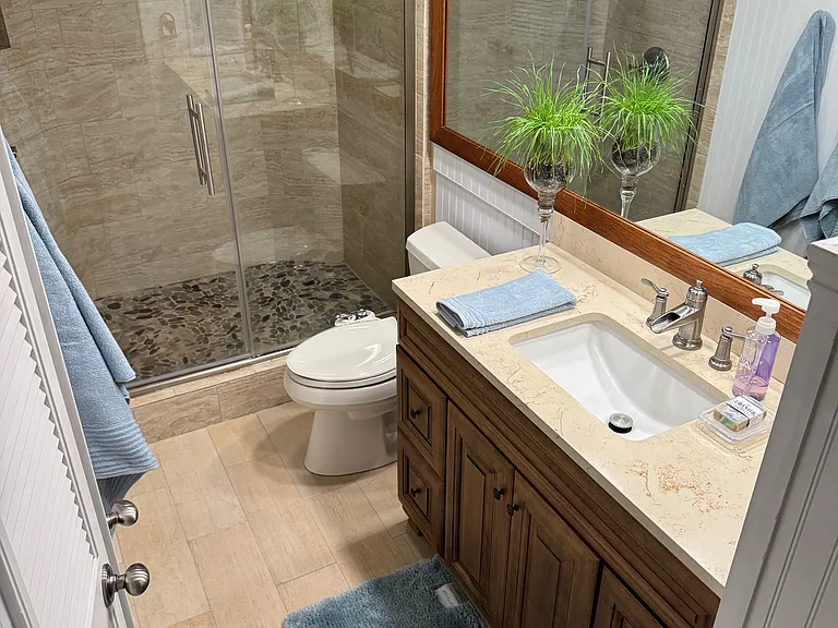 Bathroom with walk-in shower.