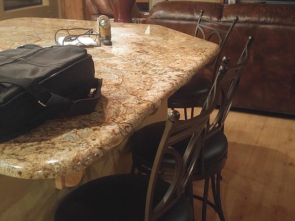 Beautiful granite island with 4 barstools for additional dining options. All kitchen counters are the same granite.