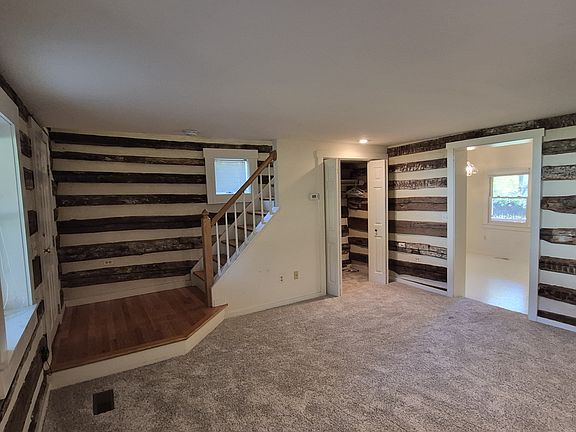 Living room and stairs and under the steps closet