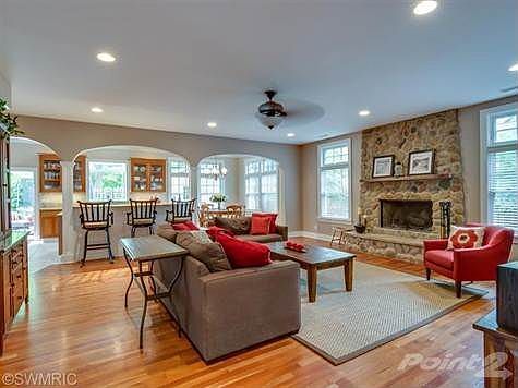 Family room opens to the kitchen.  Wonderful stone fireplace with hardwood floors.