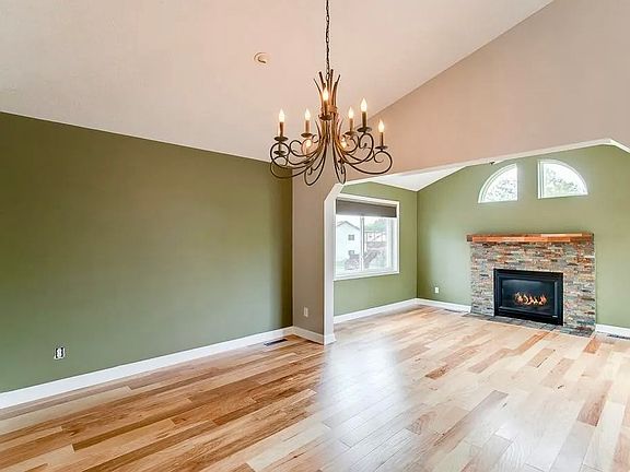 Dinning room and sitting room with fireplace and deck access.