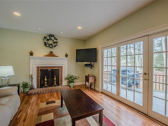 FIREPLACED FAMILY ROOM OPEN TO KITCHEN AND BACK DECK