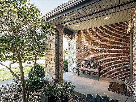 The main entry features recessed lighting along with additional exterior lighting.  There are numerous specimen planting located throughout the landscape for seasonal interest..