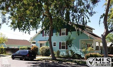 Side view of house and detached, large 2 car garage and workshop.