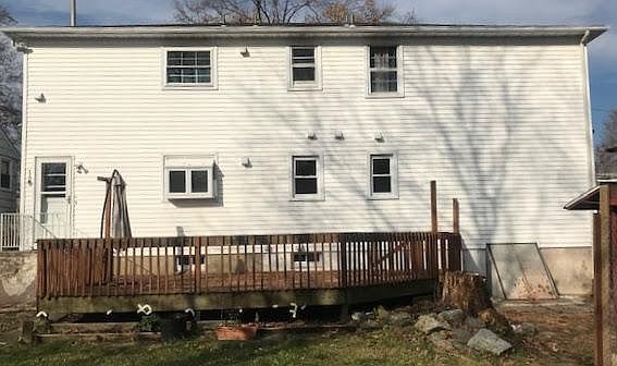 Large deck with fenced backyard