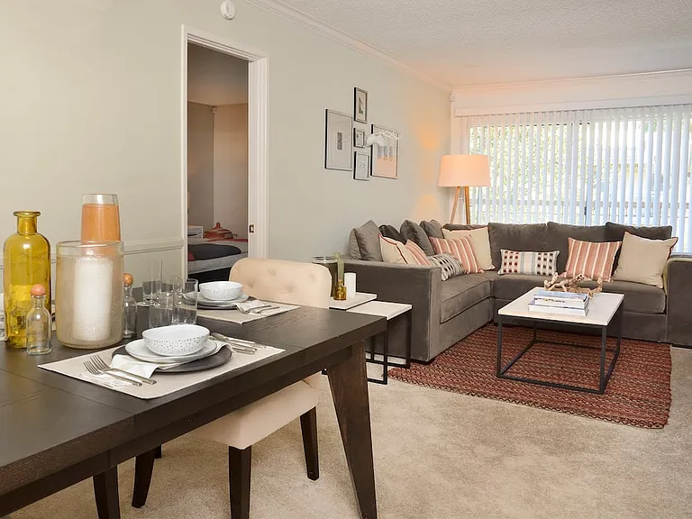 Classic Package I living and dining area with carpet