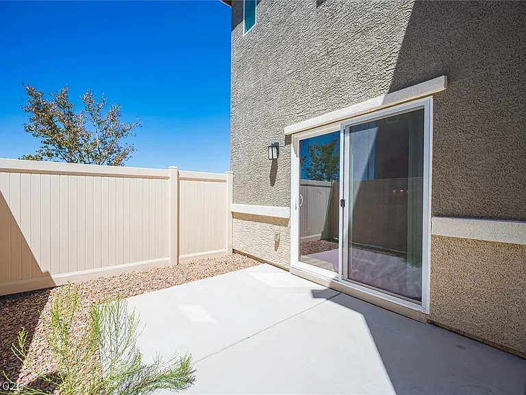 Private yard/patio: Sliding glass door to a private, fenced, low-maintenance outdoor space.
