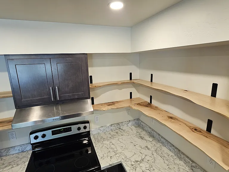 Raw Maple shelves repurposed from the Maple trees that stood on the property