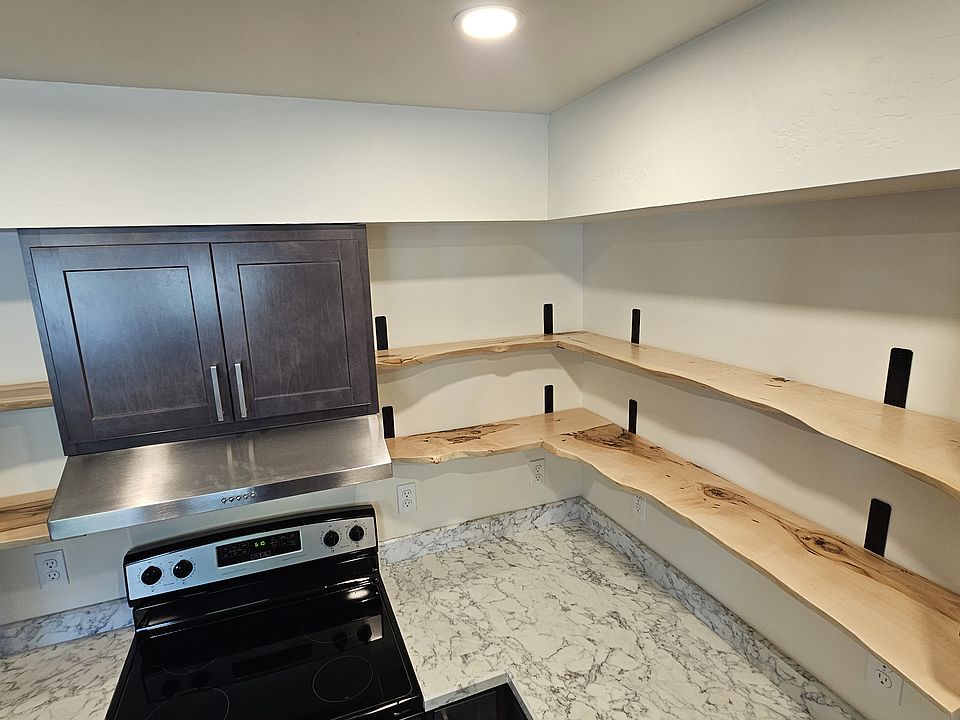 Raw Maple shelves repurposed from the Maple trees that stood on the property