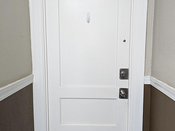 Door to the unit from the interior hallway, 4th floor