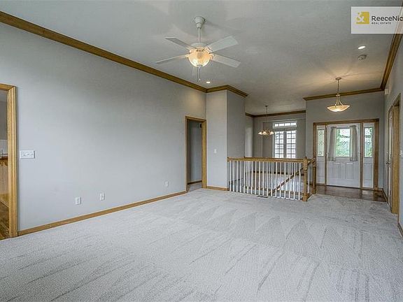 Cased openings from great room to kitchen and bedroom hallways with view of entry and dining room