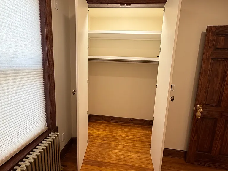 bedroom 1 - lit walk in closet